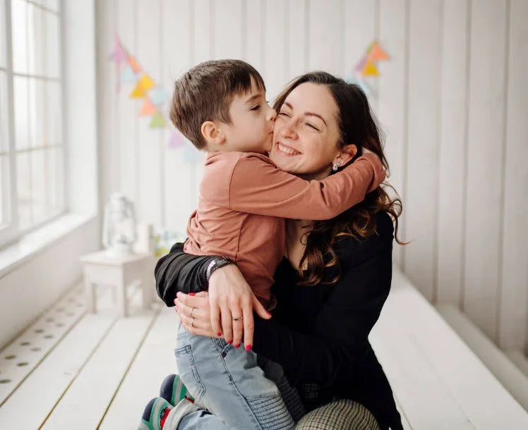 A loving moment between a mother and her son, perfect for displaying on a Picrora digital frame to relive family memories.